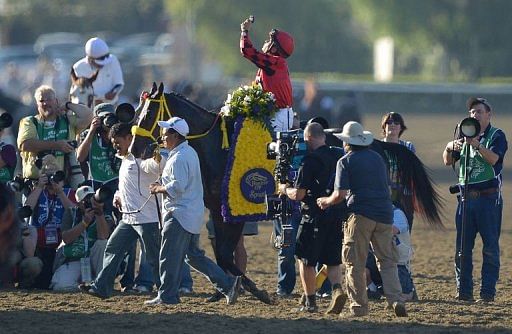 Jockeys Willie Martinez on Trinniberg celebrates after the Breeders&#039; Cup Sprint