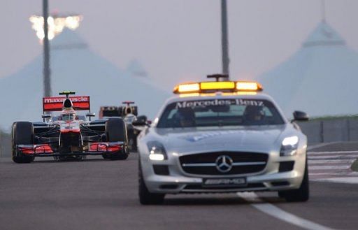 Lewis Hamilton follows the safety car at the Yas Marina circuit