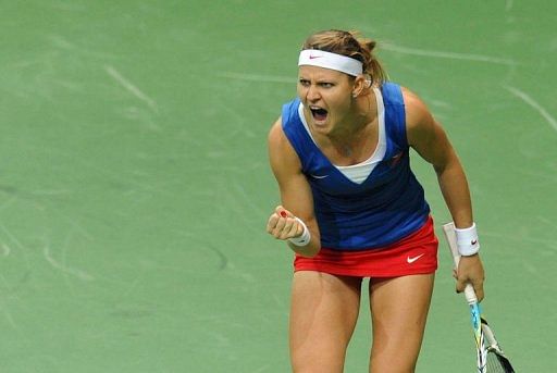 Lucie Safarova of Czech Republic reacts after winning a point against Jelena Jankovic of Serbia