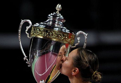 Nadia Petrova of Russia kisses her trophy after beating Caroline Wozniacki of Denmark