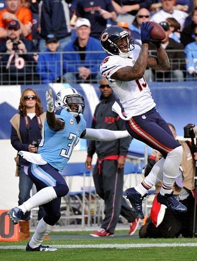 Brandon Marshall of the Chicago Bears catches a pass in front of Jason McCourty of the Tennessee Titans