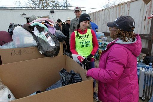 After running nearly 20 miles, Joselyn Fine lent a hand to a group of volunteers just off South Beach