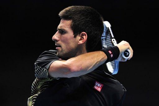 Serbia&#039;s Novak Djokovic returns against France&#039;s Jo-Wilfried Tsonga