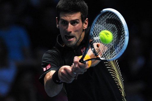 Serbia&#039;s Novak Djokovic returns a ball