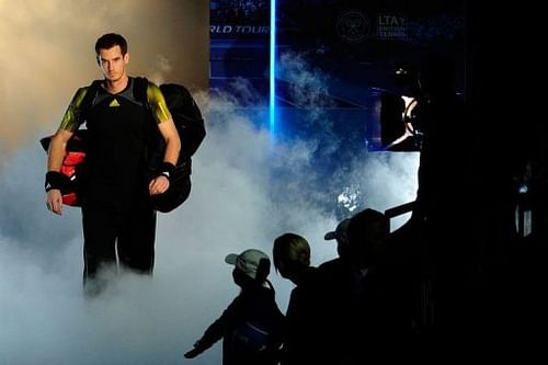 Andy Murray walks on court to play Serbia's Novak Djokovic in the ATP World Tour Finals Wednesday