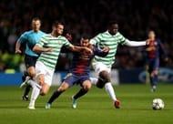 Barcelona's Pedro Rodriguez (C) trys to get between Celtic's Joe Ledley (L) and Victor Wanyama