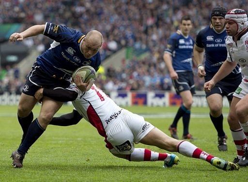 Leinster&#039;s South Africa-born Richardt Strauss (L) is tackled during the European Cup final in May