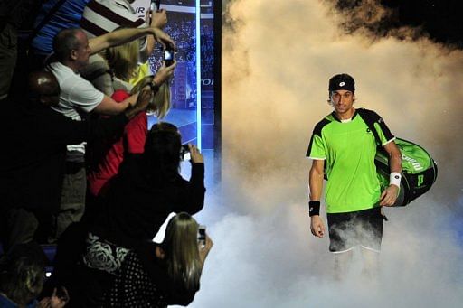 Spain&#039;s David Ferrer walks onto court to play Switzerland&#039;s Roger Federer at London&#039;s O2 Arena