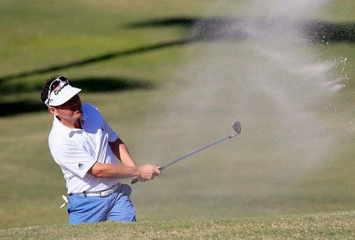 Charlie Wi of South Korea plays a shot on the 11th hole