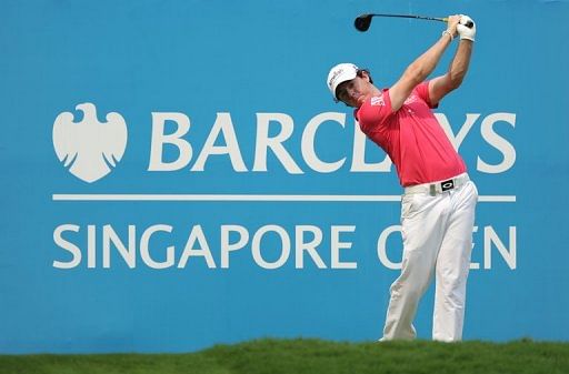 Rory McIlroy was one under par in the Singapore Open when rain halted play during the second round