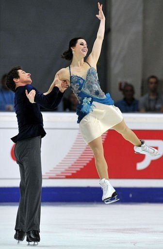 Tessa Virtue and Scott Moir of Canada perform during their ice dance short program
