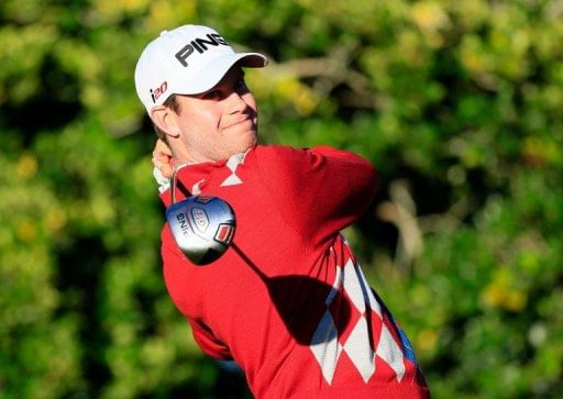 Harris English plays a shot on the 14th hole during the second round