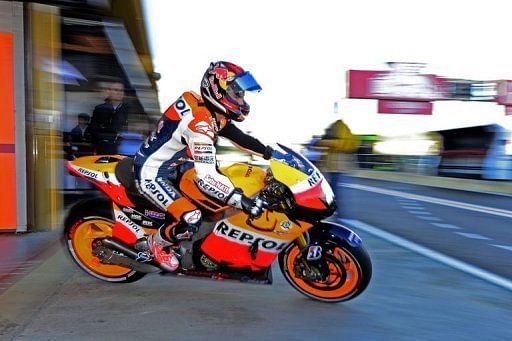 Dani Pedrosa sets off for his free practice session for the Valencia MotoGP