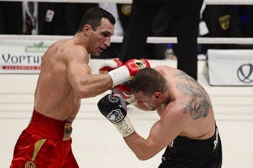 Ukrainian heavyweight boxing world champion Wladimir Klitschko (L) fights with Polish challenger Mariusz Wach