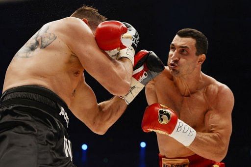 Wladimir Klitschko (R) fights with Mariusz Wach