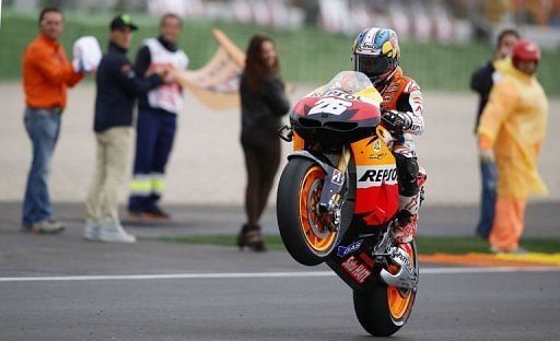 Dani Pedrosa celebrates after winning the MotoGP race at Ricardo Tormo racetrack near Valencia