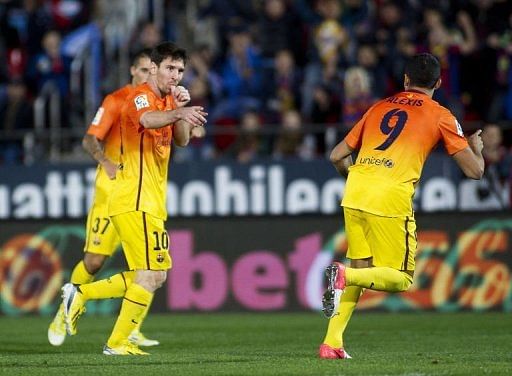 Barcelona&#039;s Lionel Messi (L) celebrates after scoring