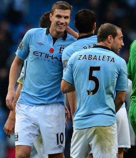 Roberto Mancini admits that Edin Dzeko (L) is not satisfied with his role as Manchester City&#039;s &#039;super sub&#039;