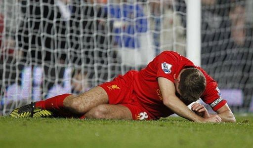Steven Gerrard lies injured during the Premier League match between Chelsea and Liverpool