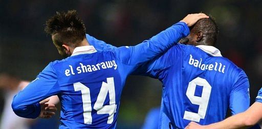 Italy&#039;s Stephan El Shaarawy (L) celebrates after scoring with Mario Balotelli