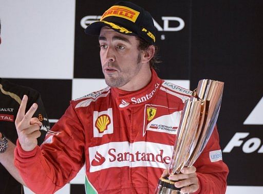 Ferrari&#039;s Spanish driver Fernando Alonso  celebrates on November 4 after the Abu Dhabi Formula One Grand Prix