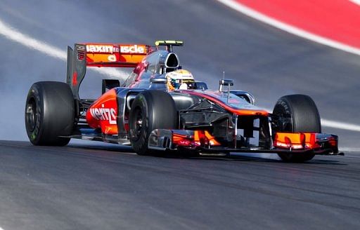 Britain&#039;s Lewis Hamilton of Team Vodafone McLaren Mercedes enters turn 1