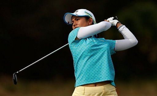 Ai Miyazato of Japan watches a shot on the 18th fairway