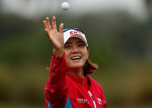 Na Yeon Choi of South Korea reaches for a golf ball