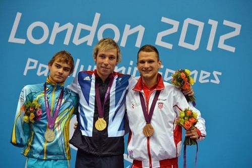 Ukraine's silver medallist Yevheniy Bohodayko (left) poses on the podium