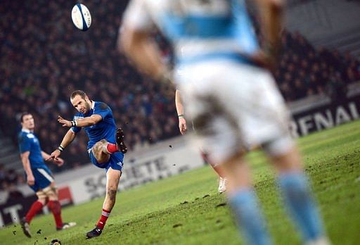 France&#039;s fly half Frederic Michalak (L) hits a penalty kick