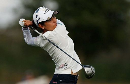 Ai Miyazato of Japan hits her tee shot on the 14th hole