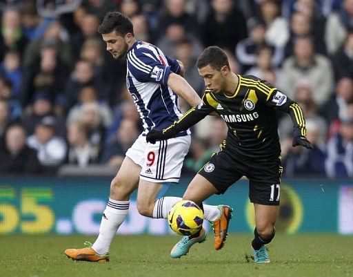 Shane Long (L) fired West Brom into an early lead before Eden Hazard (R) levelled just before half-time