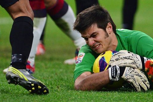 Cagliari&#039;s goalkeeper Michael Agazzi saves the ball