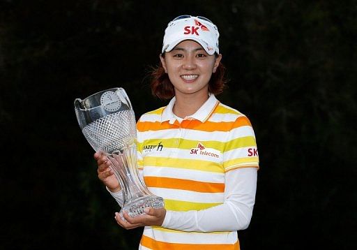 Na Yeon Choi of South Korea poses with the winner&#039;s trophy