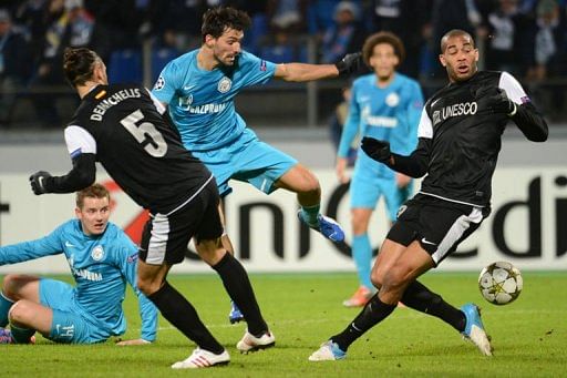 Zenit St Petersburg Danny (C) vies with Malaga&#039;s Martin Demichelis (L) and Oguchi Onyewu (R)