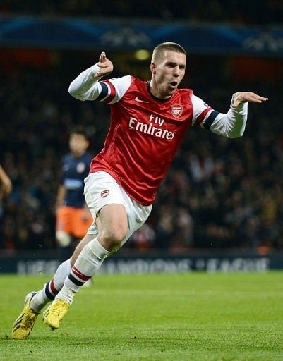 German international Lukas Podolski was on target to ease Arsenal into the knock-out stages