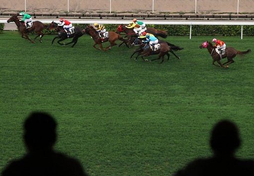 A former Hong Kong champion horse racing trainer has been jailed for corruption while running in a local election