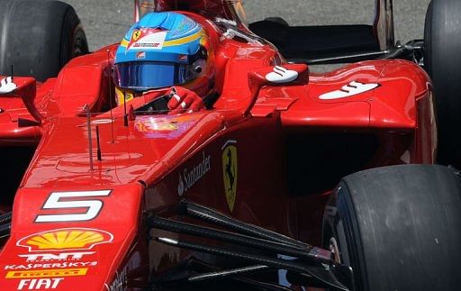 Spanish Formula One driver Fernando Alonso negociates a turn during free practice at Interlagos