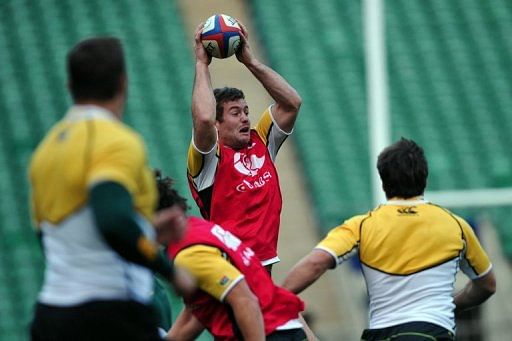 South Africa&#039;s centre Jaco Taute jumps for the ball during a training session at Twickenham in London