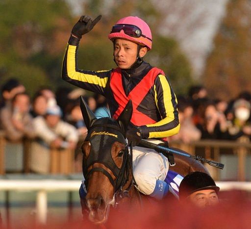 Japanese jockey Yasunari Iwata guided Gentildonna, triple filly champion this season, into the lead in the final furlong