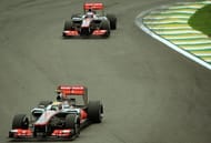 Lewis Hamilton powers his McLaren followed by teammate Jenson Button