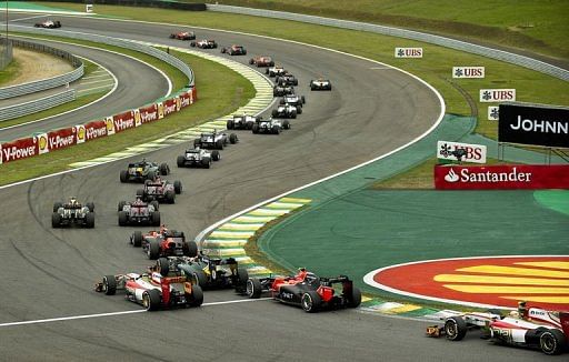 Lewis Hamilton (top L) leads the Brazil F1 GP first lap