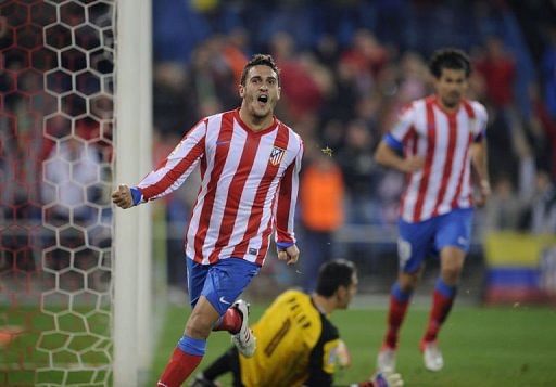 Real and Atletico put pressure on Barcelona