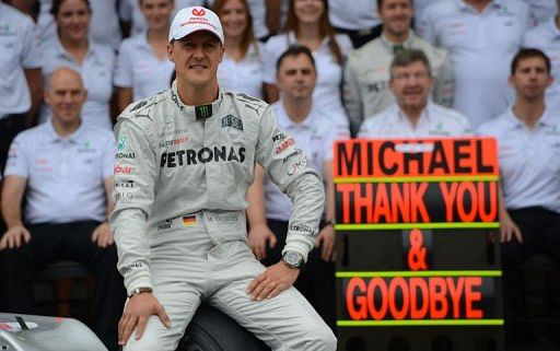 Michael Schumacher poses with the Mercedes team