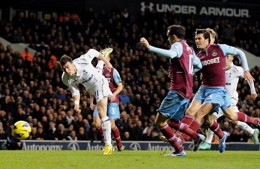 Tottenham Hotspur&#039;s Gareth Bale (left) scores a goal against West Ham