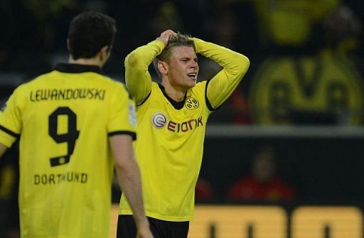 Dortmund&#039;s Lukasz Piszczek reacts after the match