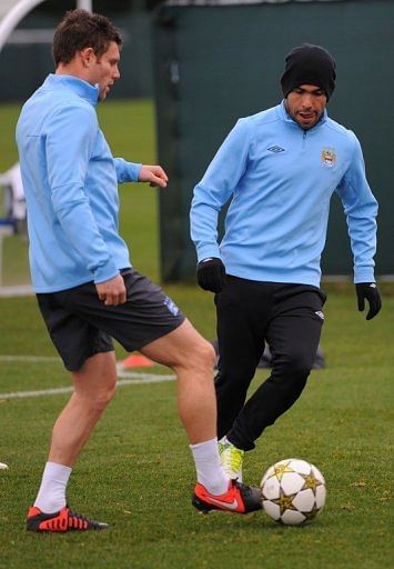 Manchester City&#039;s James Milner (L) has urged his teammates to show more killer instinct in front of goal