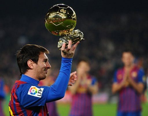 Barcelona&#039;s Lionel Messi shows his Ballon d&#039;Or Trophy in January
