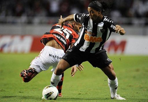 There have been occasional flashes of brilliance from Ronaldinho (right)