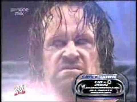 The Undertaker chokeslams mini-Undertaker